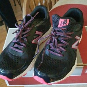 New Balance tennis shoes.
